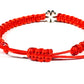 The Šnúrkový dámsky náramok štvorlístok červený features adjustable knots and a small silver four-leaf clover charm—a subtle talizman šťastia, beautifully presented on a white background.